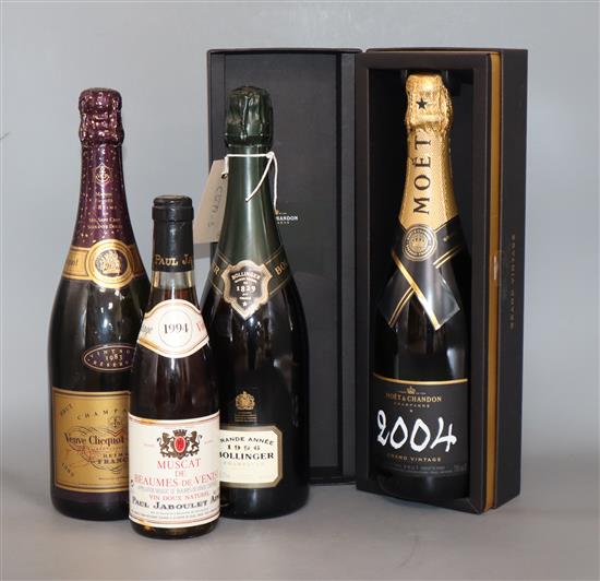 A bottle of Champagne, Moet and Chandon grand vintage 2004, a bottle of Bollinger 1996, a bottle of Veuve Cliquot Ponsardin 1983 and a